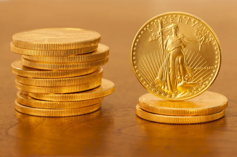 Stacked American gold dollar coins