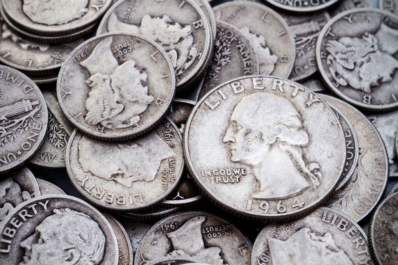 Pile of 90% silver dimes and quarters sorted at a Dallas appointment to sell silver coins